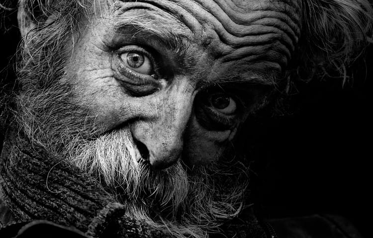 Mr. B/W
This close-up portrait was taken on November 1, 2016 in the historic centre of Prague. A few years ago I rediscovered my passion for faces telling some story. I collect these portraits on the streets while waiting for the right moment. In an affort to make intimate portraits of beggars and homeless people I’m talking with them to capture the real emotion in them. They have lot of stories to tell. Those are stories where I usually lern something new. I especially look at their eyes, feel empathy and sometimes give them money. I let them tell their stories through pictures.