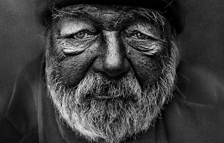 This portrait was taken on October 20, 2018 in the historic centre of Prague. A few years ago I rediscovered my passion for faces telling some story. I collect these portraits on the streets while waiting for the right moment. In an affort to make intimate portraits of beggars and homeless people I’m talking with them to capture the real emotion in them. They have lot of stories to tell. Those are stories where I usually lern something new. I especially look at their eyes, feel empathy and sometimes give them money. I let them tell their stories through pictures.