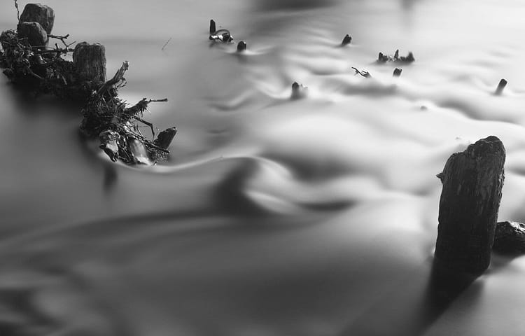 smoke near rock formation wallpaper